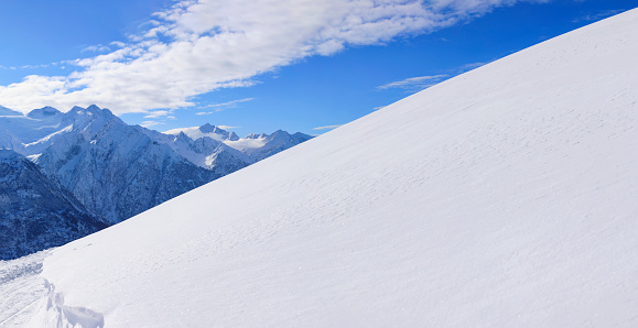 Panoramic High mountain winter landscape  Powder snow at the top. Italian Alps  ski area. Ski resort PASSO TONALE. Italy, Europe.