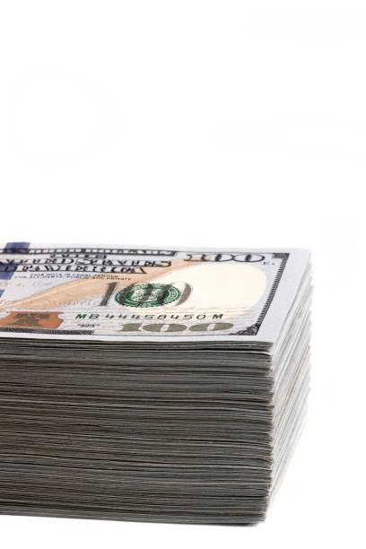 istock Large stack of American dollars on a white background 1459013886