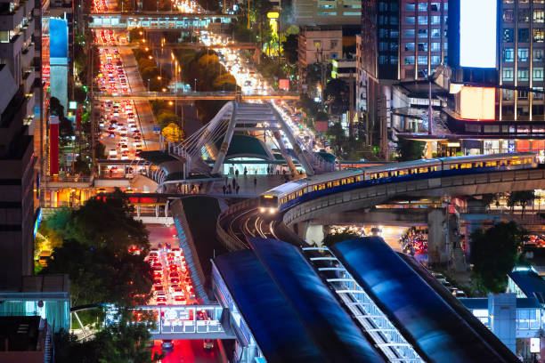 The Bangkok Skytrain passes through Chong Non Si Station a modern office building in Bangkok's downtown area at Thailand