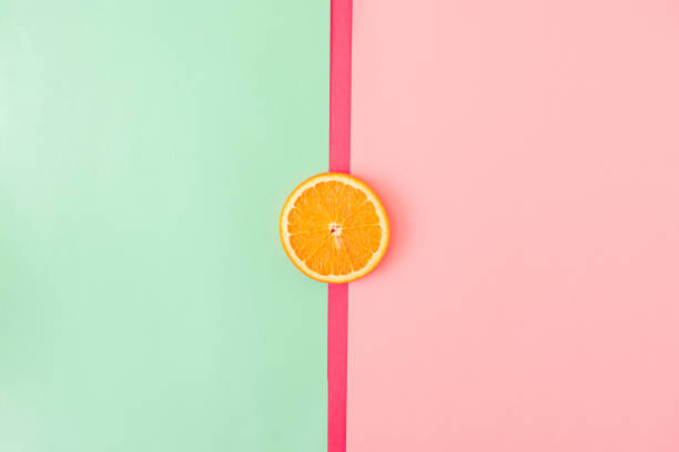 istock Geometric composition with orange slice. Minimal summer orange background concept. Summer food  wallpaper. 1459018035