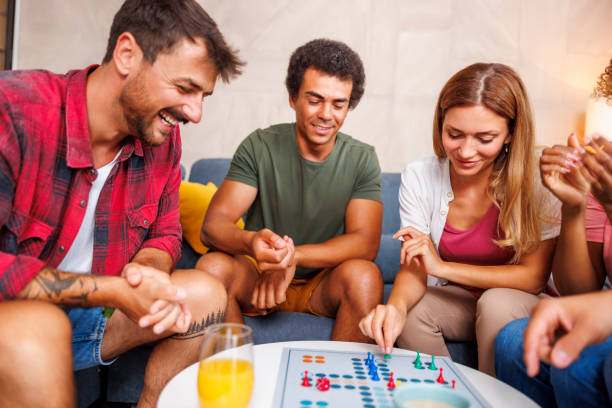 istock Friends playing ludo board game 1459019118