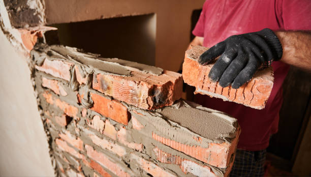 istock Male worker building brick wall at construction site. 1459019517