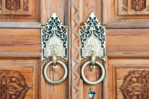Wooden pattern in door with boor handle in Tashkent, Uzbekistan