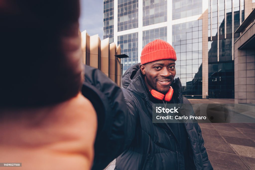 smiling african american young man influencer in street hip hip style taking posting selfie or story or reel 30-34 Years Stock Photo