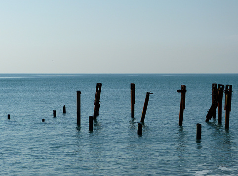 pillars of the destroyed pier on the sea