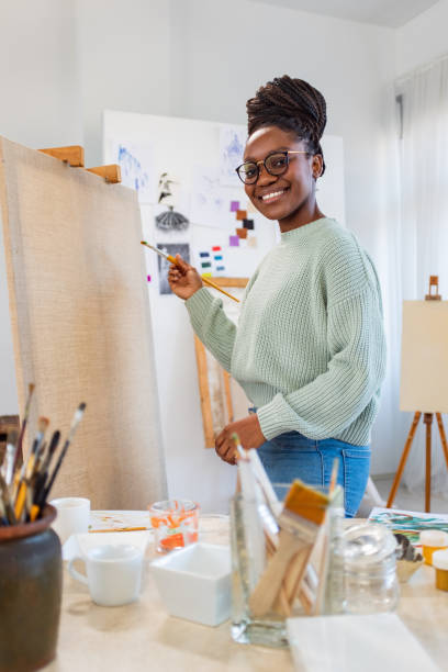 istock Young artist working in her painting studio 1459027694