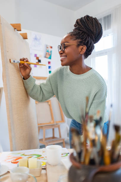 istock Young artist working in her painting studio 1459028038