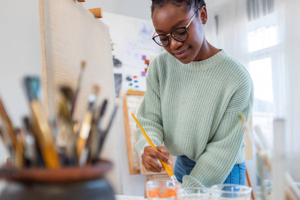 istock Young artist working in her painting studio 1459028041