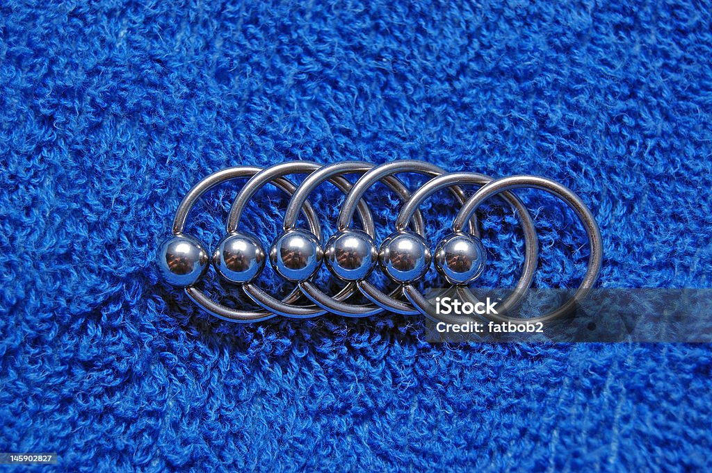 Circulars Many circulars for piercing on blue background Pierced Stock Photo