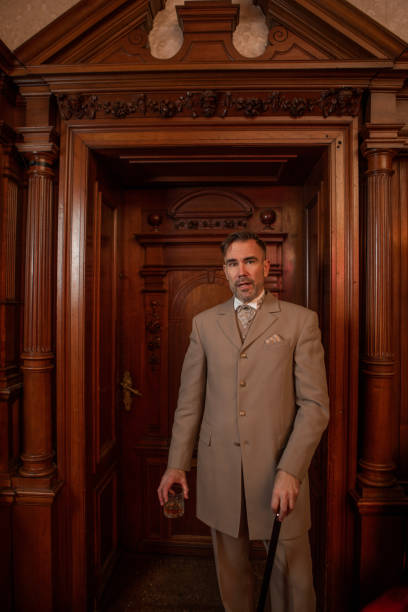 istock A handsome elegant 1920s style gentleman in a luxury stately home 1459030757