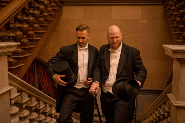 istock Two handsome 1920s style gentlemen in a luxury brown bar 1459031377