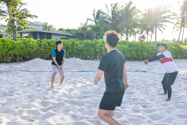 istock On the move, Southeast Asians playing beach volley, backlit image 1459031866