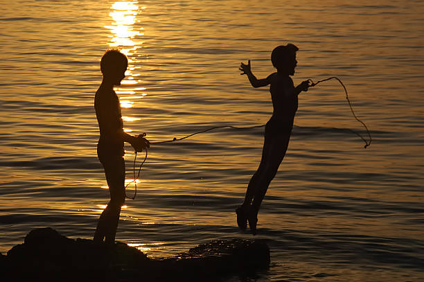 istock Children playing in the water 145903376