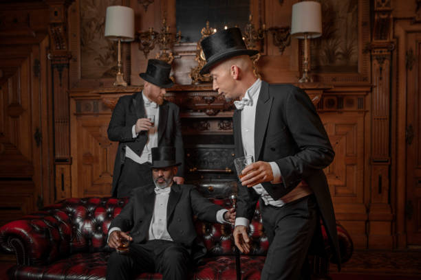 istock Three handsome 1920s style gentlemen in a luxury stately home 1459033991