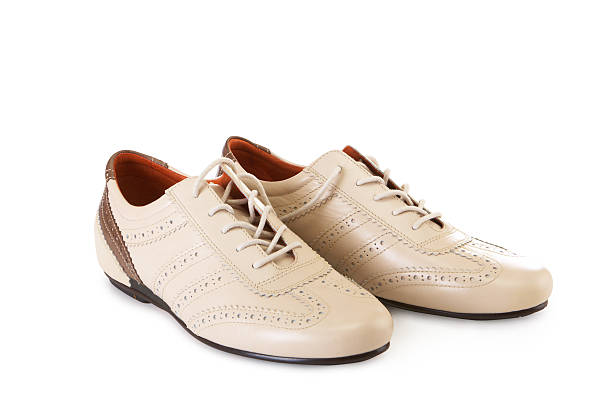 istock New beige shoes on white background 145903439