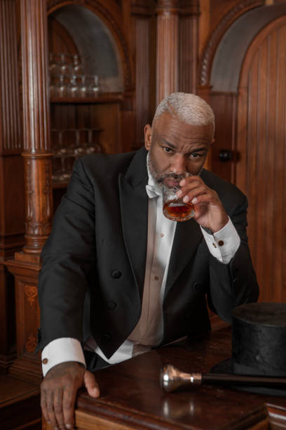 istock A handsome elegant 1920s style black gentleman in a luxury drawing room 1459035069