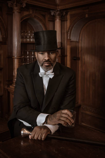 istock A handsome elegant 1920s style black gentleman in a luxury drawing room 1459035070