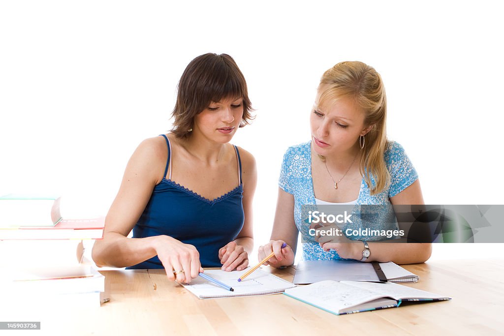 Students Two students helping each other out with their studies Adult Stock Photo