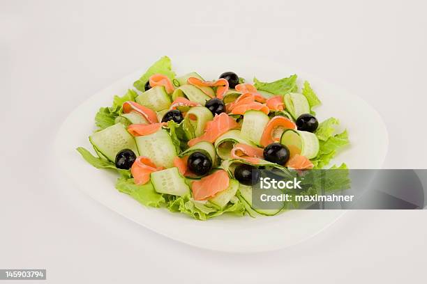 Salad With Red Fish And Cucumbers Stock Photo - Download Image Now - Black Color, Black Olive, Clipping Path