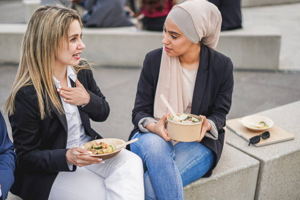 multiracial business people eating lunch outdoor from office - meeting and entrepreneur concept - chinese ethnicity latin american and hispanic ethnicity multi ethnic group business person imagens e fotografias de stock