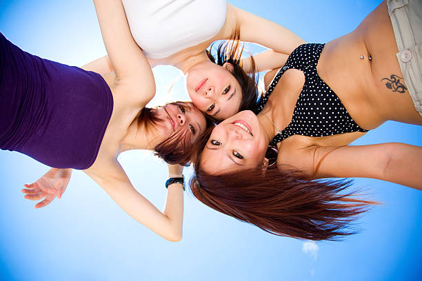 istock girls having fun under sunny blue sky 145904007