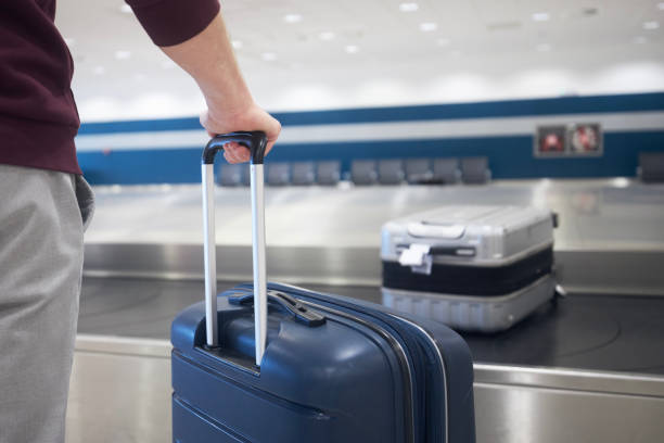 istock Suitcase in baggage claim in airport terminal 1459042689