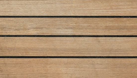 Teak wood detail of cruise ship deck floor. Top view. Full frame. Close-up. High resolution.