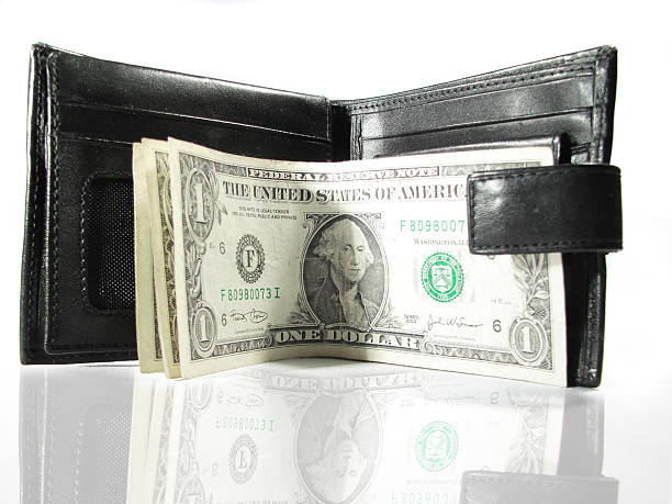 Cтоковое фото Черная кожаная сумочка с Бумажные деньги доллар спереди