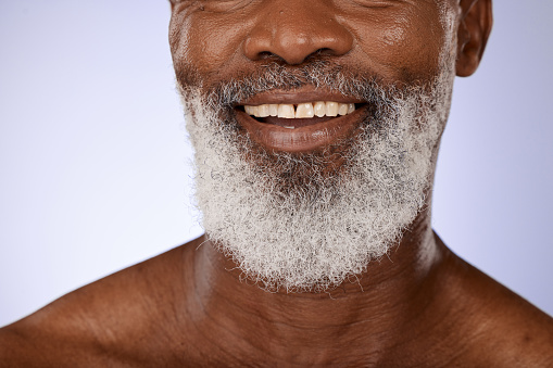 Zoom, dental or teeth of a black man with smile after dentist appointment for teeth whitening or cleaning in studio. Tooth, mockup or happy elderly person with mouth or oral hygiene smiles with pride