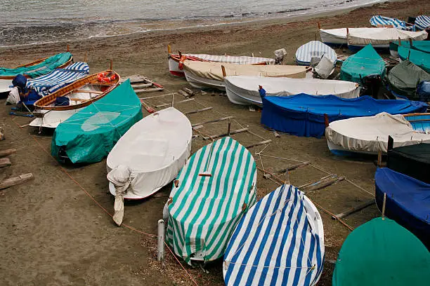 Photo of Covered boats on a beach