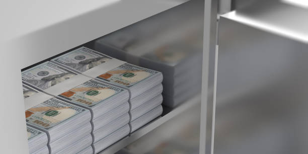 istock 100 US Dollar money stacks in safe, close-up 1459054389