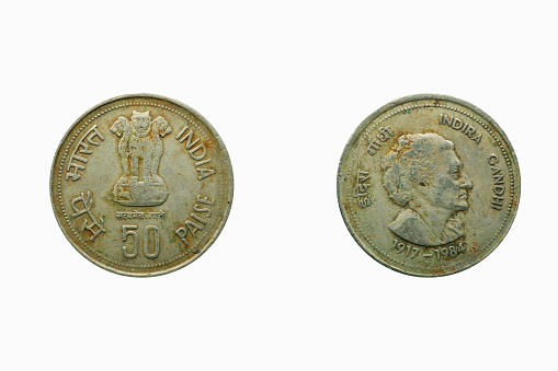 50 paise Indian coin currency, behind Indira Gandhi inprint, studio shot against white background