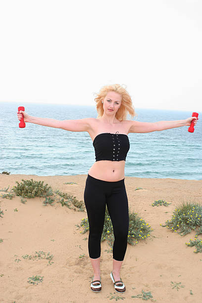 Girl with dumbbells 1 stock photo