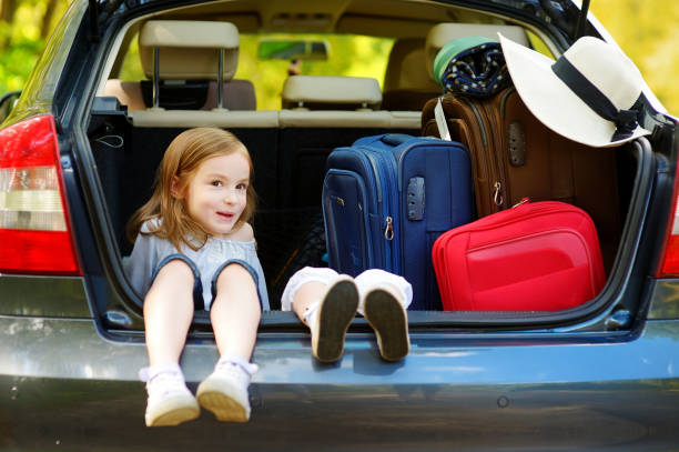 istock Two adorable little sisters sitting in a car 1459061334