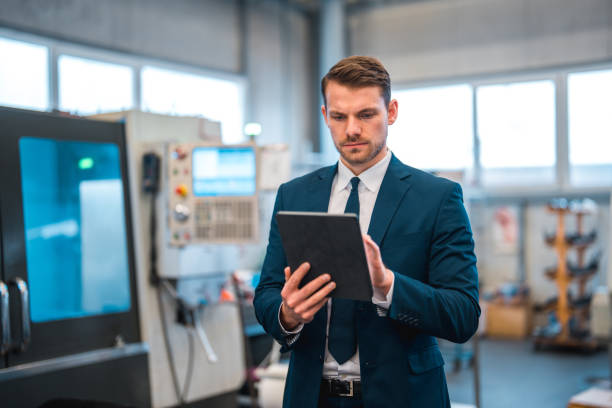 istock White Male Manager Using Wireless Technology In A Factory 1459063169