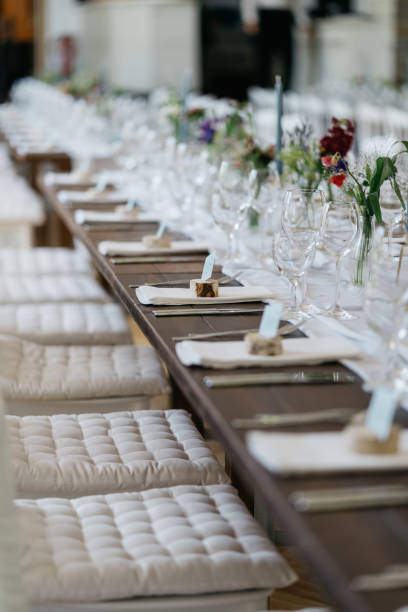 Table setting at a luxury wedding reception. Beautiful flowers on the table.