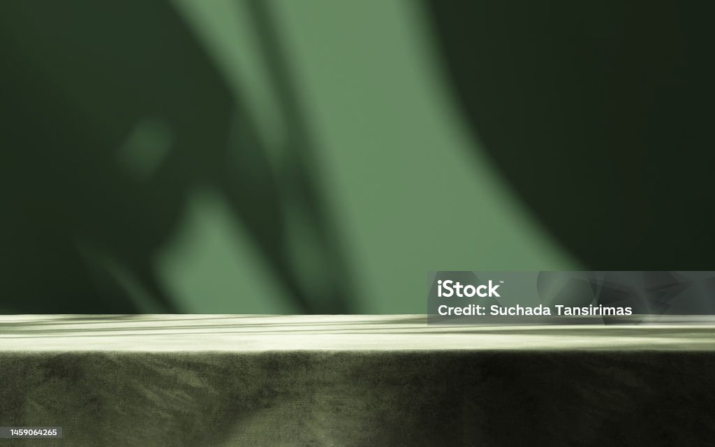 Table countertop with dark green velvet tablecloth in sunlight, tropical leaf shadow on blank wall Table countertop with dark green velvet tablecloth in sunlight, tropical leaf shadow on blank wall in background for luxury food, beverage, nature, organic beauty cosmetic, fashion product display Backgrounds Stock Photo
