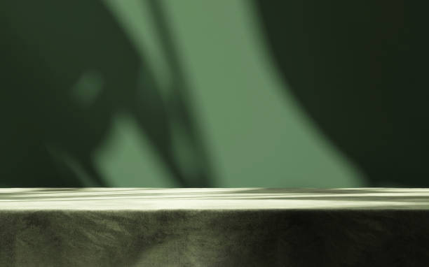 Table countertop with dark green velvet tablecloth in sunlight, tropical leaf shadow on blank wall Table countertop with dark green velvet tablecloth in sunlight, tropical leaf shadow on blank wall in background for luxury food, beverage, nature, organic beauty cosmetic, fashion product display beauty product photography stock pictures, royalty-free photos & images