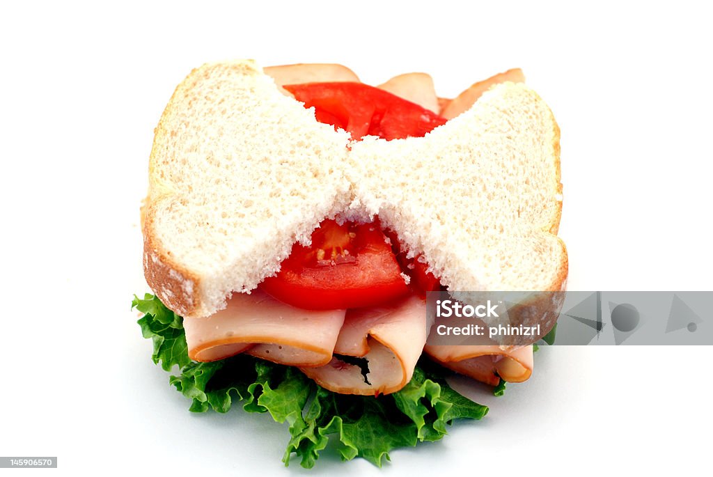 Skinny Sandwich Low-carb diet concept with skinny bread slices on an isolated turkey sandwich Bread Stock Photo