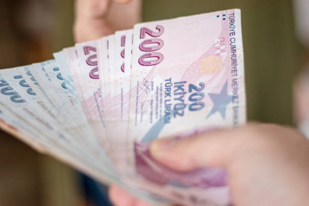 istock Man Giving Turkish Lira 1459065953
