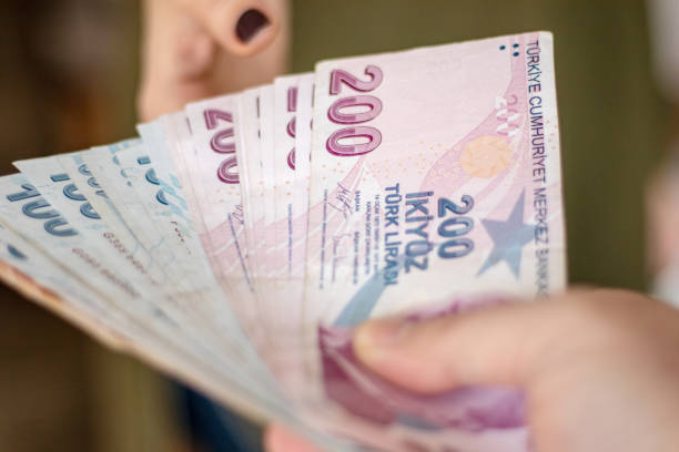 istock Man Giving Turkish Lira 1459066046