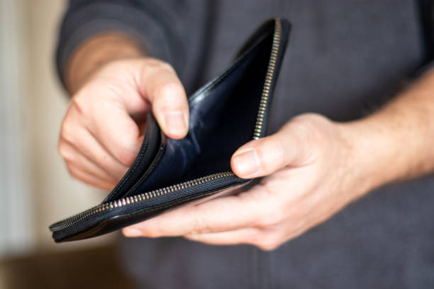 istock Man Holding Empty Wallet And Turkish Lira 1459066098