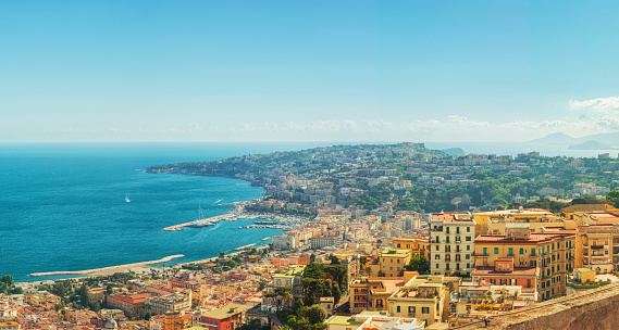 Aerial panoramic view of Naples city on the coast of Mediterranean sea, Campania, Italy. Cityscape of Napoli. Travel destination