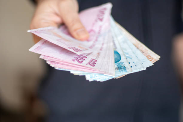 istock Man Holding Turkish Lira 1459066195