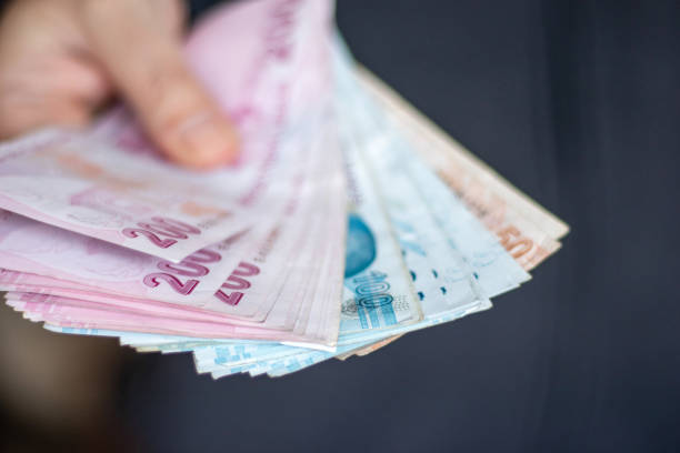 istock Man Holding Turkish Lira 1459066288