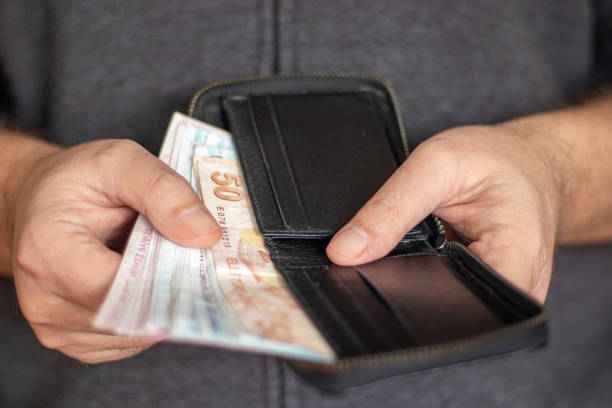 istock Man Holding Wallet And Turkish Lira 1459066464