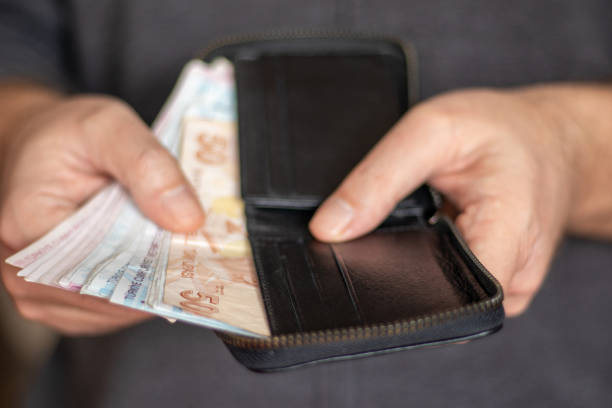 istock Man Holding Wallet And Turkish Lira 1459066626