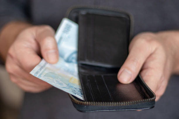 istock Man Holding Wallet And Turkish Lira 1459066670