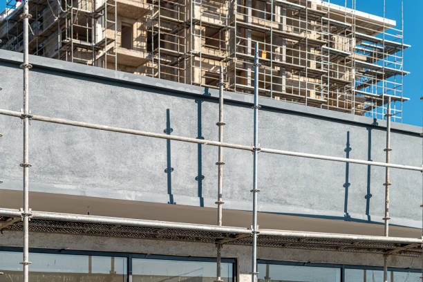 istock Construction scaffolding built on a new apartment building. new construction under construction 1459066799