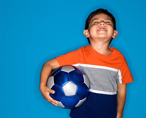 istock Hispanic boy holding soccer ball. 145906776